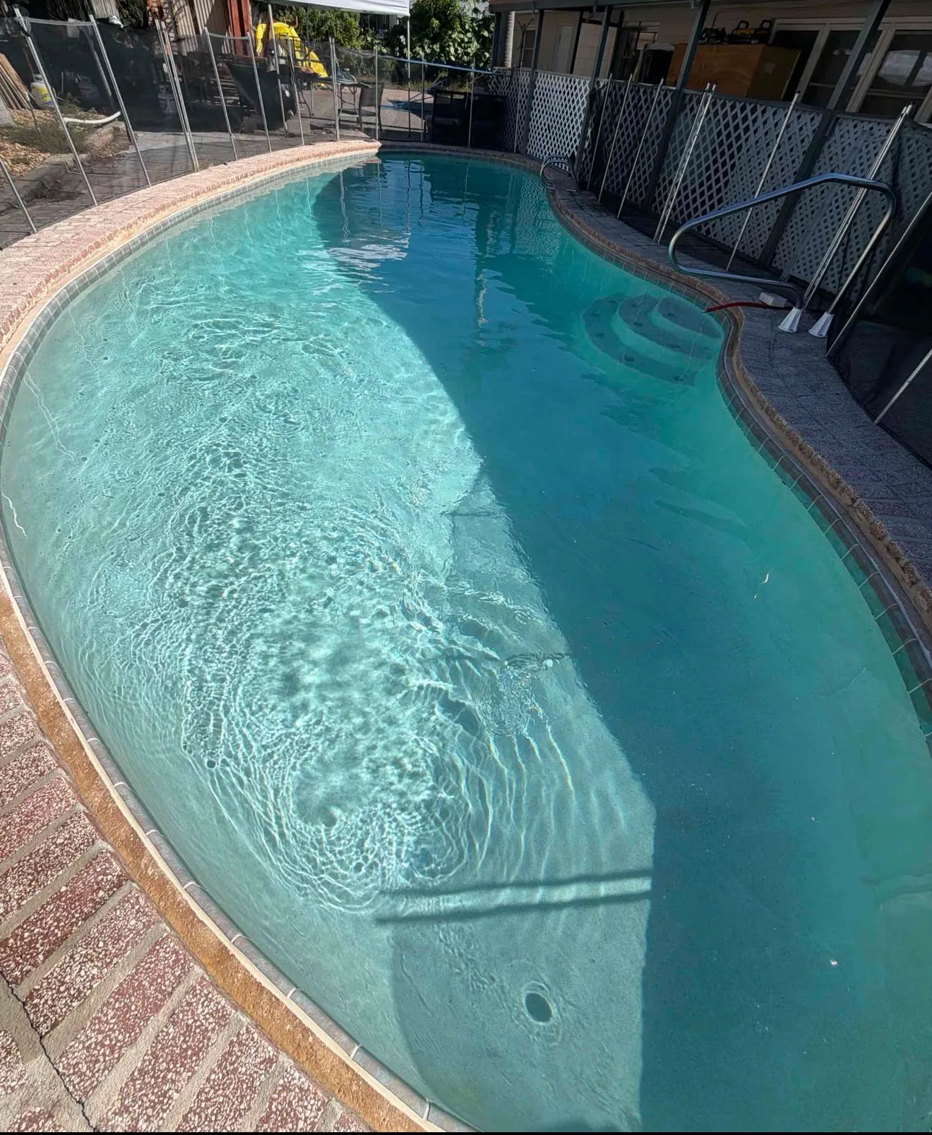 Clean, crystal-clear residential swimming pool serviced by Jonathan Pool Service in Polk County, Florida